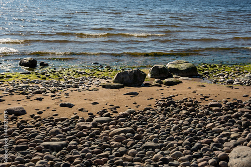 Fototapeta Naklejka Na Ścianę i Meble -  the rocky beach of the baltic sea with blue skies