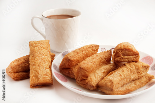 Indian khari or kharee or salty Puffy brown Snacks, served with indian hot tea, Indian Breakfast with Copy Space. photo