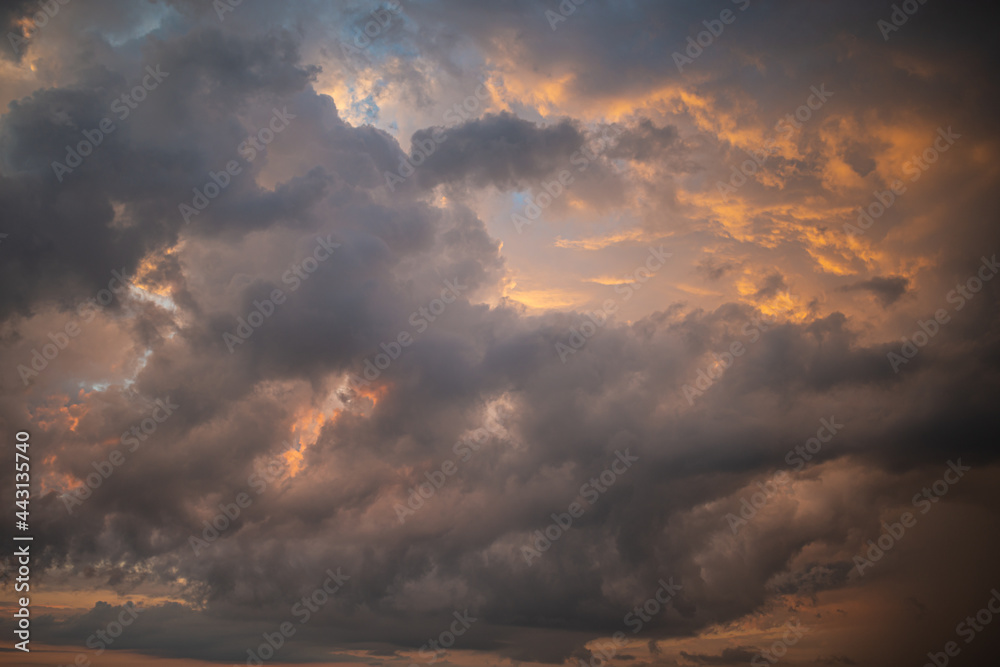 Fototapeta premium a dark thundercloud on the background of sunset