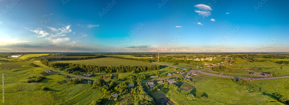 aerial panoramic landscape over the village of Bolshoi Samovets (Voronezh region, center of Russia) on a hot summer evening in June