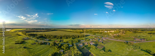aerial panoramic landscape over the village of Bolshoi Samovets (Voronezh region, center of Russia) on a hot summer evening in June