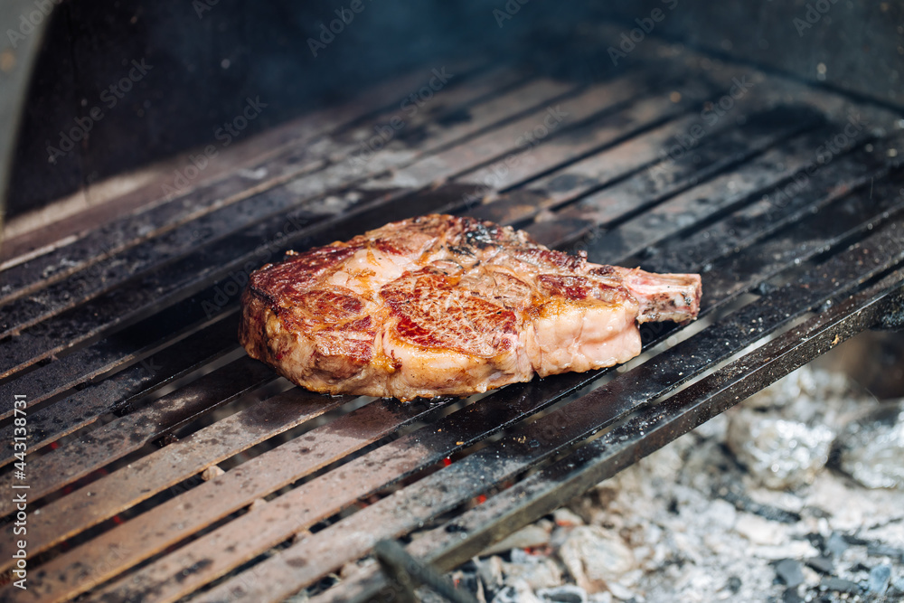 Dry aged rib eye steak on a charcoal grill