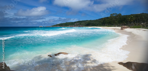 Turquoise indian ocean and white beach in La Digue Island, Seychelles