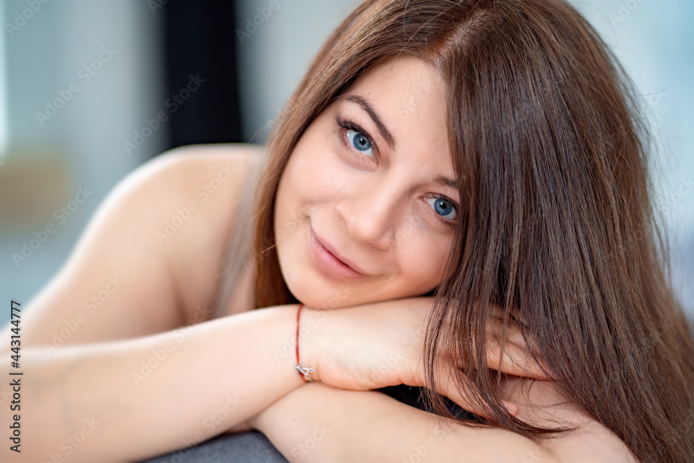 portrait of an attractive brunette woman. facial and hair care. portrait of an attractive brunette woman. facial and hair care.