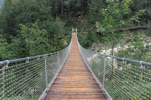 Fototapeta Naklejka Na Ścianę i Meble -  The Hangebrucke, hanging wooden bridge in the forest of Berchtesgaden National Park, Germany