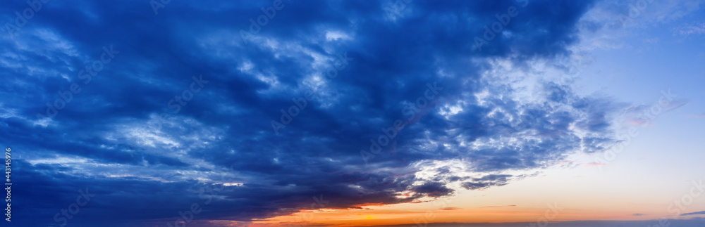 Fototapeta premium Beautiful natural sky backround at sunset with dark clouds.