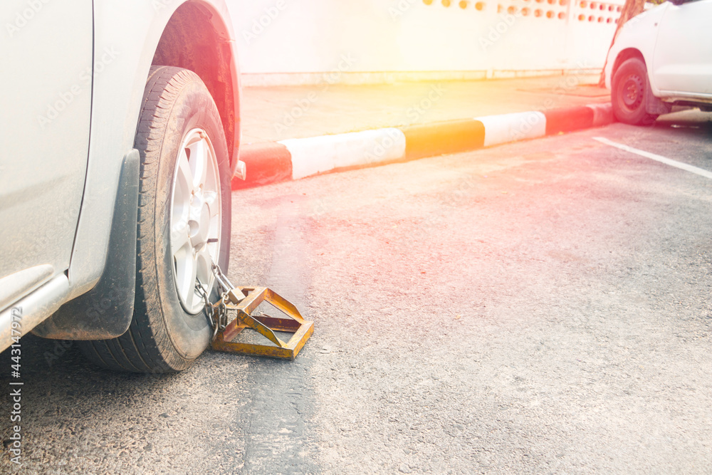 Locked wheel of car.Car wheel lock for parking in a place not allowed