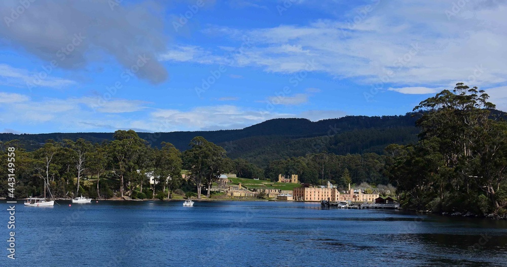 he military district and ruins of the penitentiary  as seen from the ferry out to isle of the dead and point puer,   at port arthur historic site, port arthur, tasmania, australia