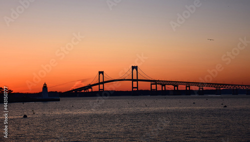 the claiborne pell newport bridge from jamestown to newport, rhode island, over narragansett bay, with a spectacular sunset