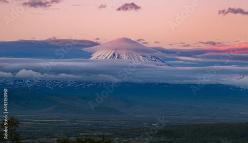 Kamchatka, lenticular cloud at the top of the Koryaksky volcano at sunset