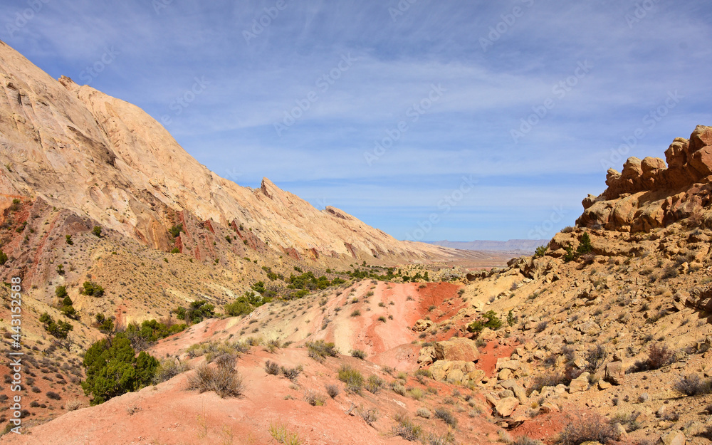 colorful flatiron rock formations and pink sands along the uneva canyon hike on a sunny day in the san rafael swell near green river, utah