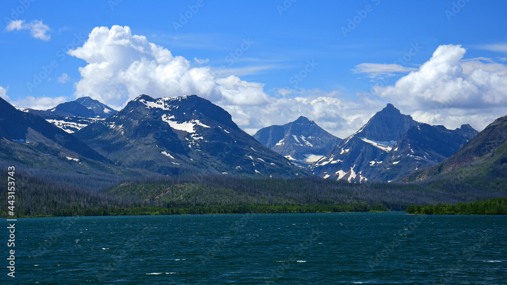 spectacular panorama of fusillade mountain and gunsight ridge from the wild goose island lookout in glacier national park, montana