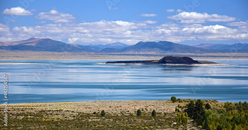 paoha island on a sunny fall day, in the middle of turqouise-colored alkaline soda  mono lake, near lee vining, california photo