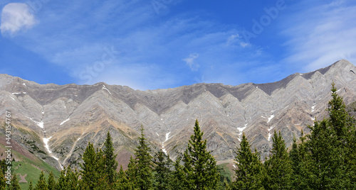 spectacular mountain peaks in summer along route 40 in the peter loughwood provincial park enroute to banff national park, alberta, canada photo