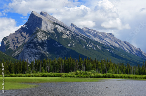 dramatic mount rundle on a sunny day, as seen across the vermilion lakes in banff national park, alberta, canada, in the rocky mountains photo