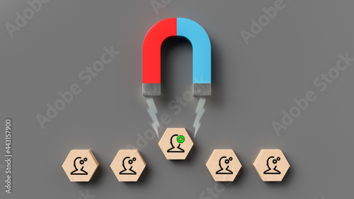 magnet attracting a hexagon with a person symbol on it on grey background photo