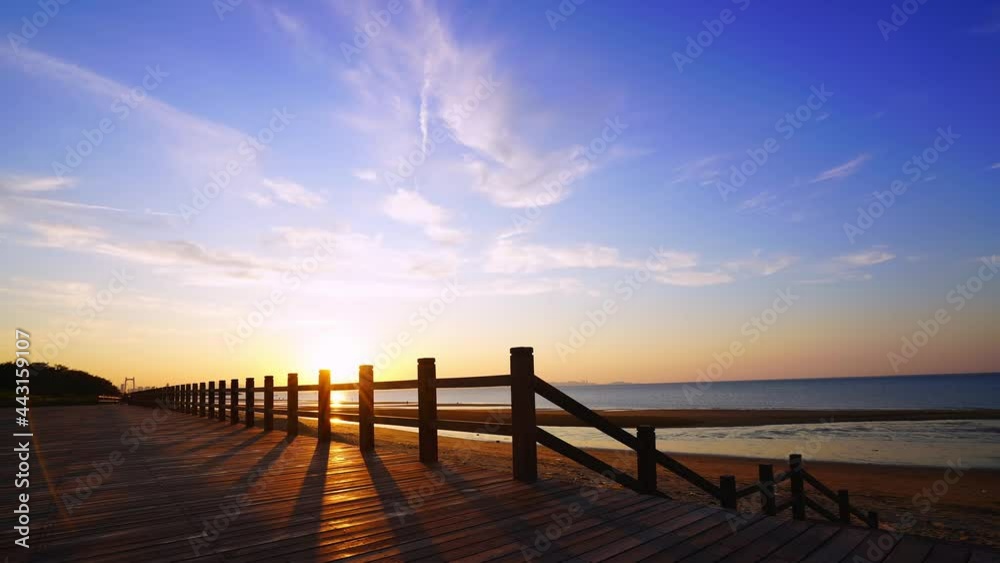 time lapse of bay at sunset, beautiful sea and wooden bridge time lapse of bay at sunset, beautiful sea and wooden bridge