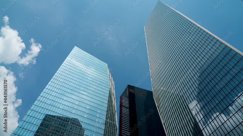 Business and finance concept, moody. view looking up at modern office building architecture in the yeouido financial district, seoul,south korea. Business and finance concept, moody. view looking up at modern office building architecture in the yeouido financial district, seoul,south korea.