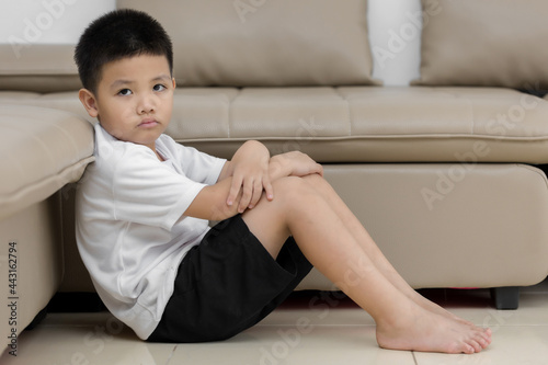 Asian child sitting alone with sad feeling, Concept for depression stress or frustration