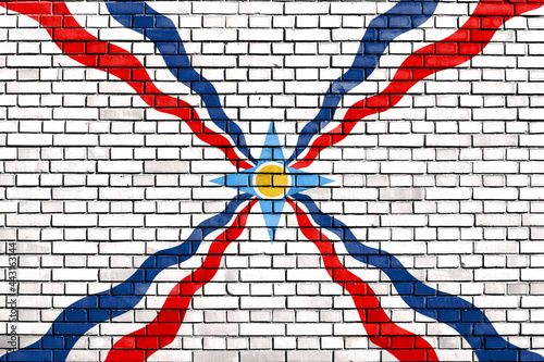 flag of Assyrians painted on brick wall photo