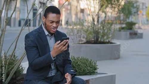 Wallpaper Mural Mad stressed black guy holding cellphone annoyed with error spam message, slow stuck broken smartphone, angry frustrated African businessman by mobile phone problem having complaints on bad service. Torontodigital.ca