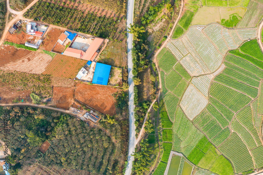 Fototapeta premium aerial view of a village field and river