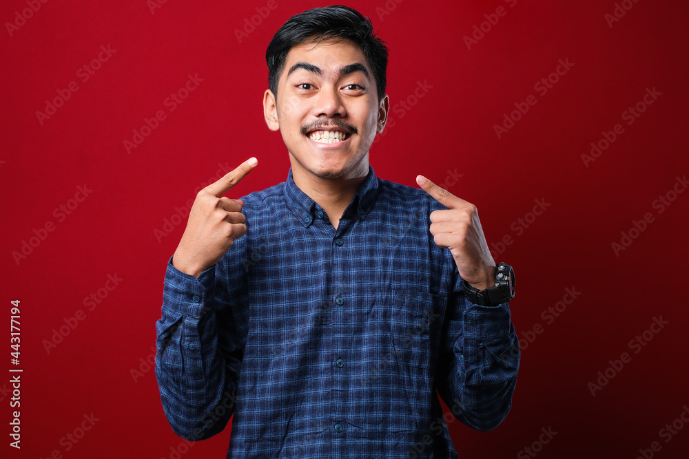 Young handsome man wearing casual sweater smiling cheerful showing and pointing with fingers teeth and mouth. Dental health concept. Young handsome man wearing casual sweater smiling cheerful showing and pointing with fingers teeth and mouth. Dental health concept.