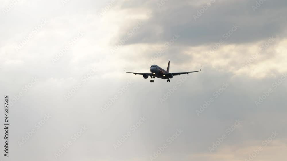 A passenger plane in the cloudy sky A passenger plane in the cloudy sky