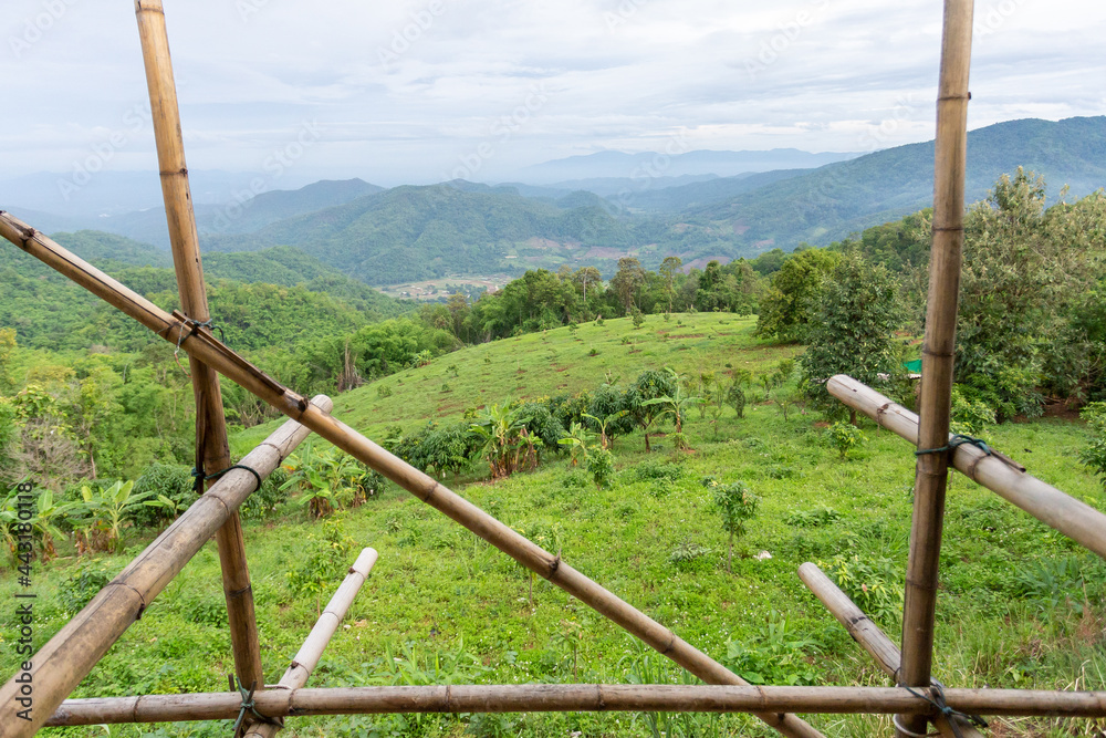 View of the landscape in front of the house that is being built, showing the bamboo frame. View of the front of the house on the top of the mountain see the beautiful sky mountains View of the landscape in front of the house that is being built, showing the bamboo frame. View of the front of the house on the top of the mountain see the beautiful sky mountains