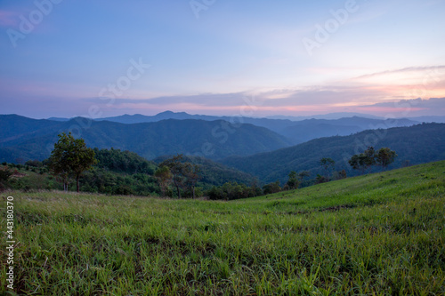Sunset mountain scenery, green fields, agricultural areas that Thailand. Beautiful mountain views and space for text above.