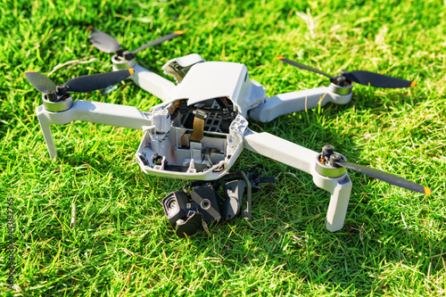 Wallpaper Mural Accident with a drone. Damaged quadcopter on green grass Torontodigital.ca