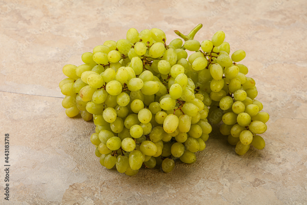 Green grape branch over background Green grape branch over background