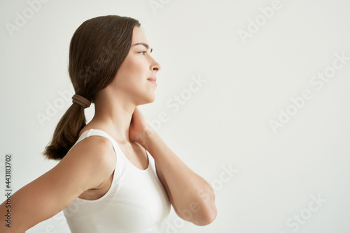 woman in white t-shirt body pain chronic illness medicine