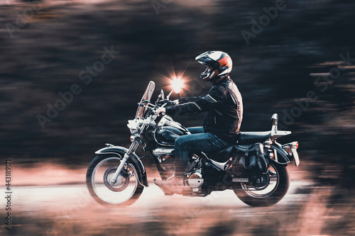 Fototapeta Naklejka Na Ścianę i Meble -  Motorbike on country road riding. Having fun driving the empty road on a motorcycle tour journey.