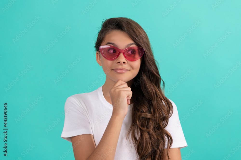 funky teen girl having fun. cheerful child in sunglasses has curly hair. fashion accessory. funky teen girl having fun. cheerful child in sunglasses has curly hair. fashion accessory.