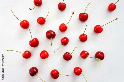 Top view of a pattern cherry arrangments on white background