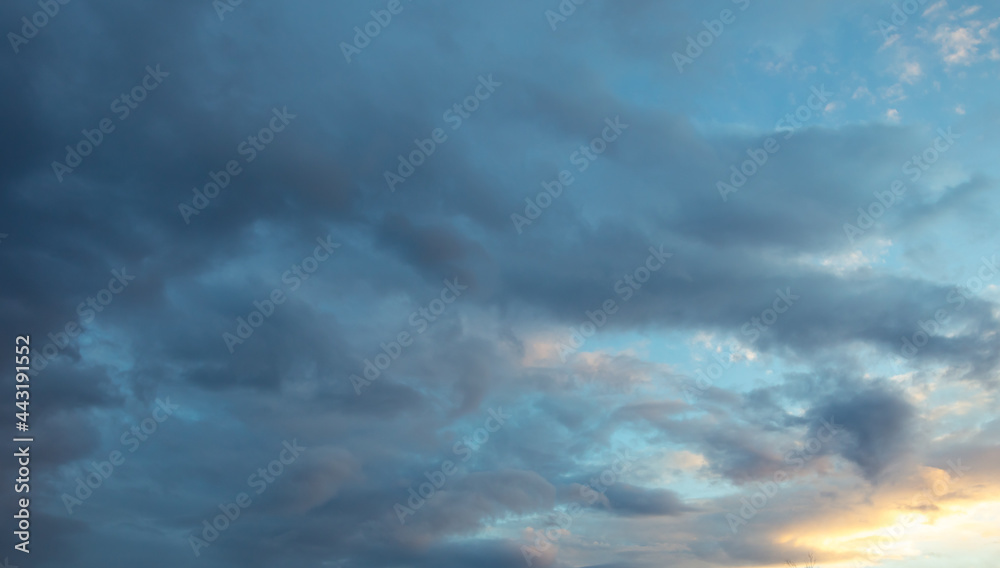Fototapeta premium Rain clouds in the sky at sunset