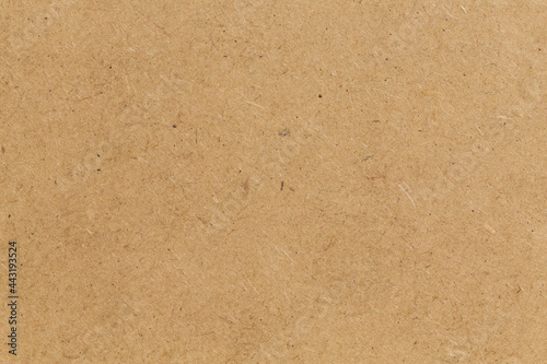 Pressed beige chipboard texture.