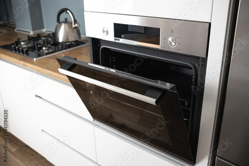 NEw electric oven in modern kitchen interior