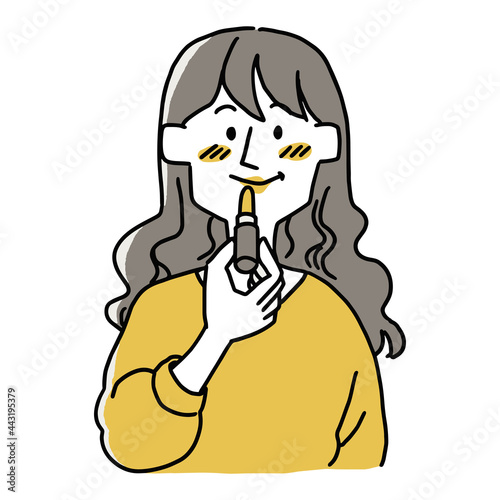 口紅を塗っている女性