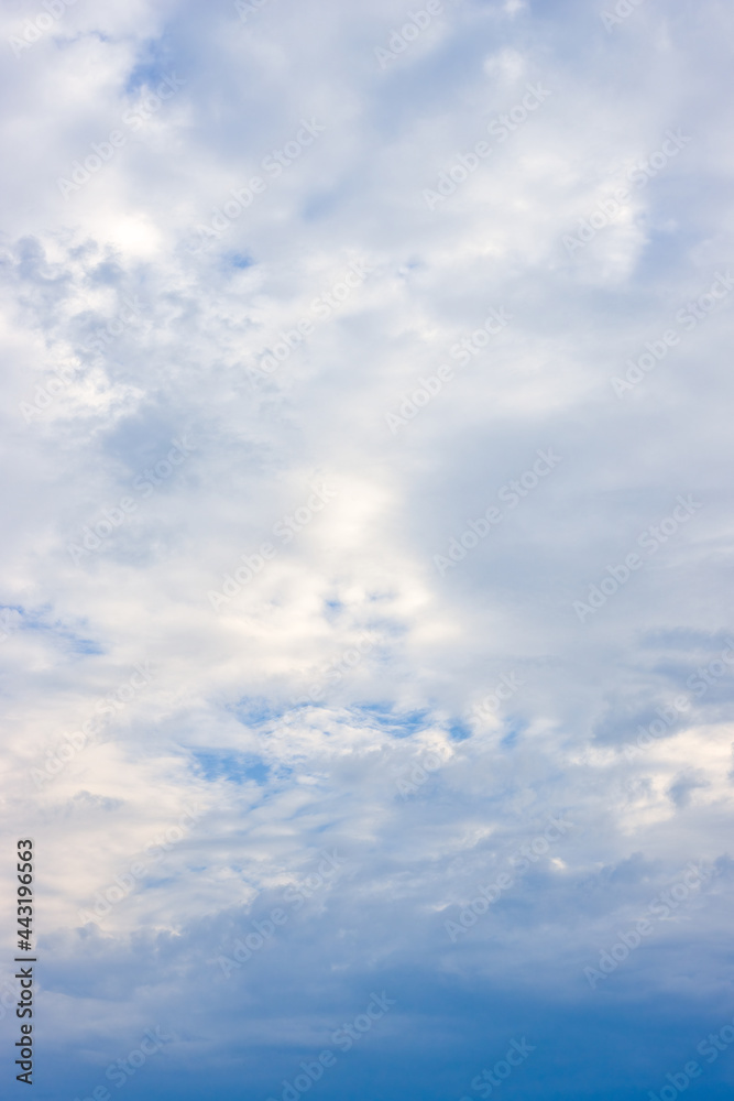 Bright white cloudy sky vertical view