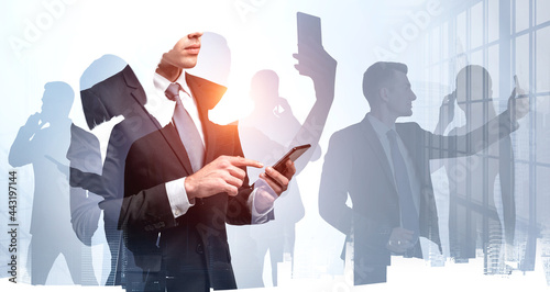 Fotografie Silhouettes of busy business people contacting via smartphones at distance using different types of communications, double exposure