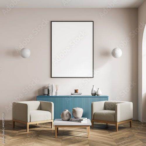 Waiting room interior with poster, two armchairs, blue sideboard © ImageFlow