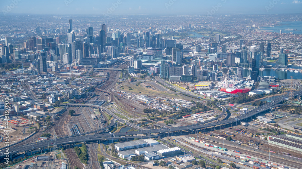 MELBOURNE - SEPTEMBER 8, 2018: Melbourne aerial city view with skyscrapers, railway and interstate road