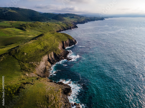 Aerial view of the coast with large cliffs at sunset. Cantabria.