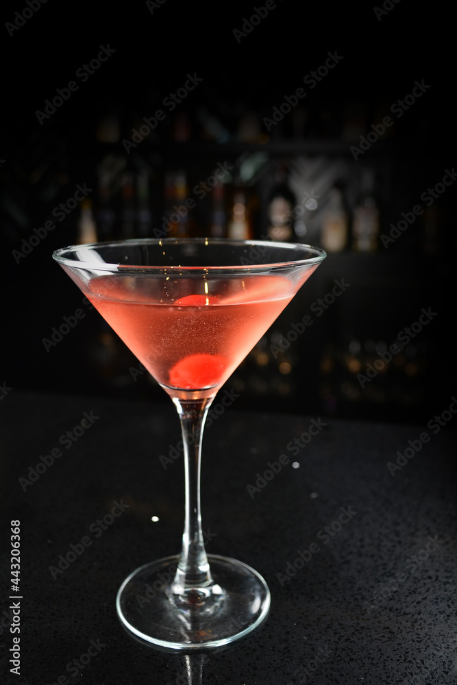 bartender special cold red alcohol bloody mary cocktail with cherry juice in tall glass goblet on black background luxury hotel pub iced beverage menu bartender special cold red alcohol bloody mary cocktail with cherry juice in tall glass goblet on black background luxury hotel pub iced beverage menu