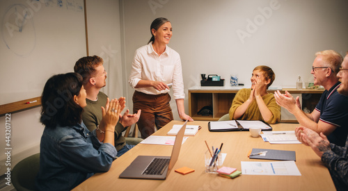 Executive appreciated by clapping for successful strategy planning