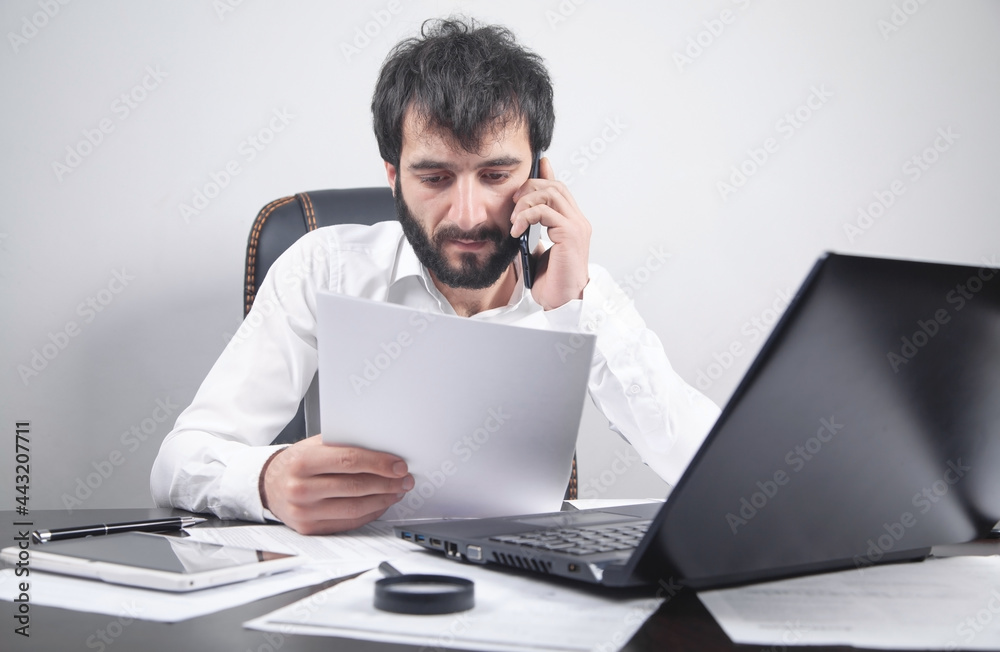 Man reading document in office. Business Man reading document in office. Business