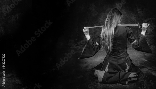 Kneeling Woman with sword