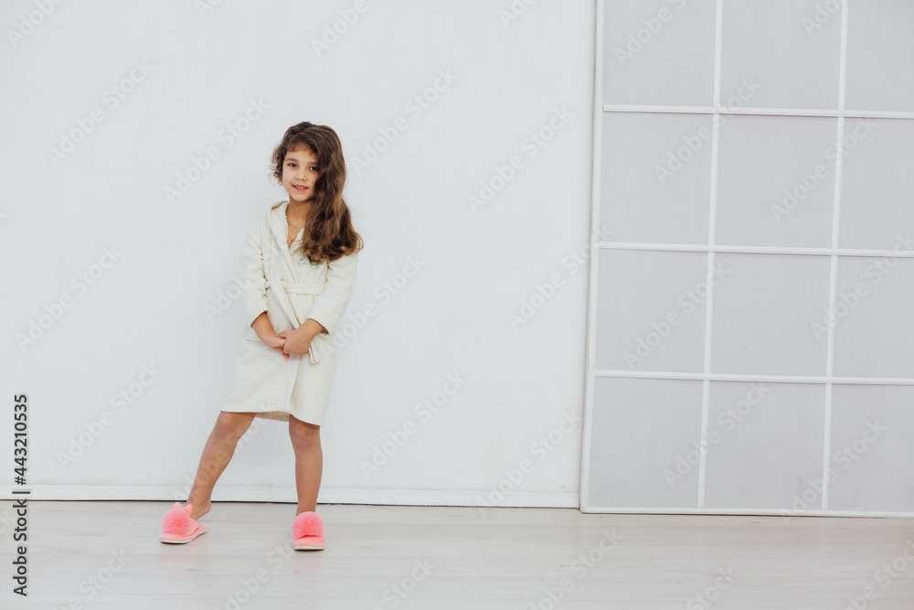 Beautiful little girl in bathrobe after bath Beautiful little girl in bathrobe after bath